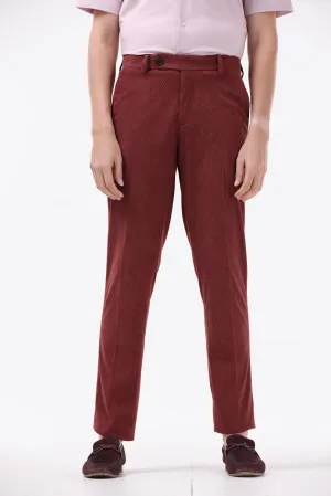 STATEMENT CORDUROY TROUSERS IN WINE